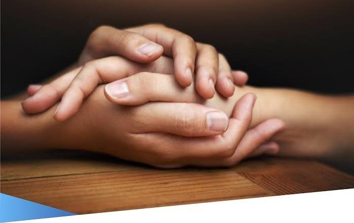 Hands touching, representing connection and emotional support